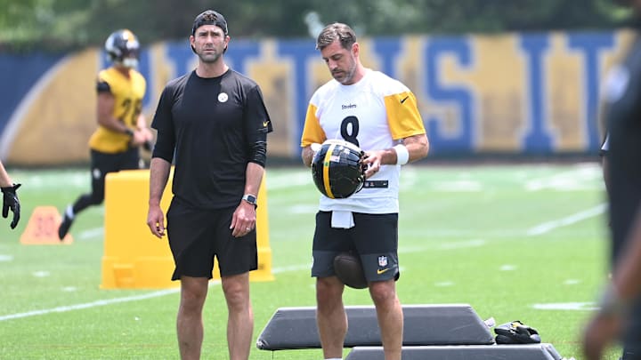 Jun 10, 2025; Pittsburgh, PA, USA;  Pittsburgh Steelers quarterback Aaron Rodgers (8) puts on his helmet during minicamp at their South Side facility. Mandatory Credit: Philip G. Pavely-Imagn Images