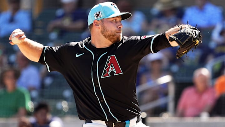 Arizona Diamondbacks pitcher Corbin Burnes throws to the Milwaukee Brewers in the second inning of a spring training game.