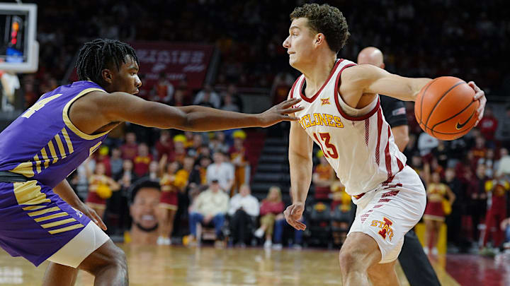 Iowa State Cyclones guard Cade Kelderman (13) passes the ball around Alcorn State Braves guard Bryson Calamese (4) during the first half on Dec. 3, 2025, at Hilton Coliseum, in Ames, Iowa.