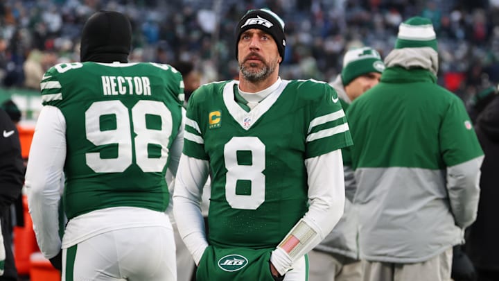 Jan 5, 2025; East Rutherford, New Jersey, USA; New York Jets quarterback Aaron Rodgers (8) looks on during the first quarter of their game against the Miami Dolphins at MetLife Stadium. Mandatory Credit: Ed Mulholland-Imagn Images