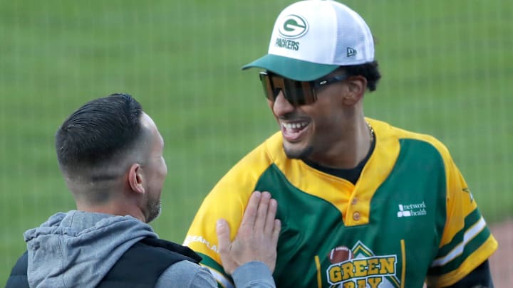 Green Bay Packers coach Matt LaFleur shares a laugh with Jordan Love during the Green Bay Charity Softball Game on May 23. Green Bay Packers coach Matt LaFleur shares a laugh with Jordan Love during the Green Bay Charity Softball Game on May 23.