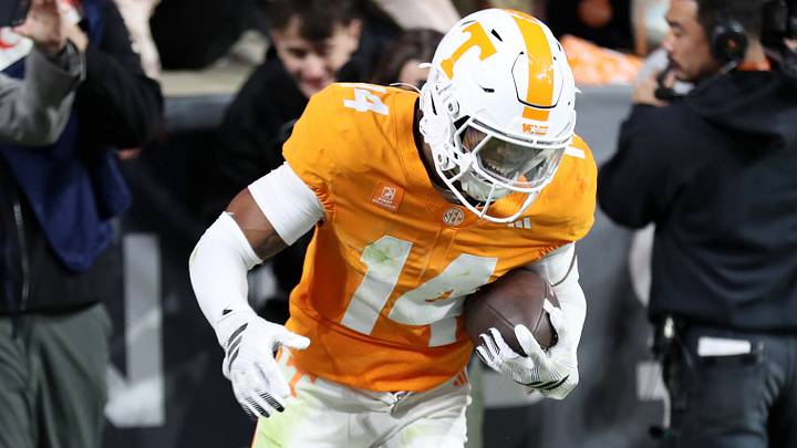 Oct 17, 2026; Knoxville, Tennessee, USA;  Tennessee Volunteers defensive back Kayin Lee (14) intercepts teh ball against the Alabama Crimson Tide during the second half at Neyland Stadium.  Mandatory Credit: Randy Sartin-Imagn Images