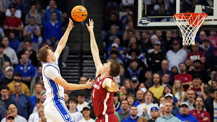 Mar 29, 2025; Newark, NJ, USA; Duke Blue Devils forward Cooper Flagg (2) shoots the ball against Alabama Crimson Tide forward Grant Nelson (4) during the first half in the East Regional final of the 2025 NCAA tournament at Prudential Center. Mandatory Credit: Robert Deutsch-Imagn Images