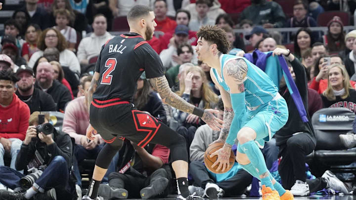 Jan 17, 2025; Chicago, Illinois, USA; Chicago Bulls guard Lonzo Ball (2) defends Charlotte Hornets guard LaMelo Ball (1) during the first quarter at United Center. Mandatory Credit: David Banks-Imagn Images