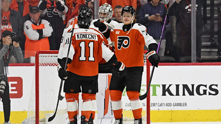 Apr 22, 2026; Philadelphia, Pennsylvania, USA; Philadelphia Flyers right wing Owen Tippett (74) celebrates win with right wing Travis Konecny (11) against the Pittsburgh Penguins in game three of the first round of the 2026 Stanley Cup Playoffs at Xfinity Mobile Arena.