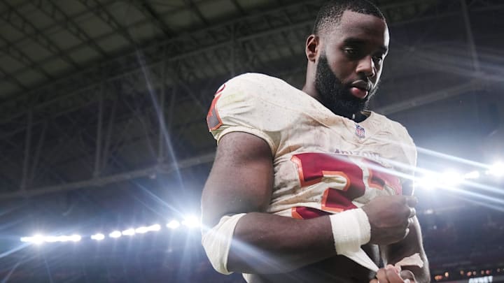 Arizona Cardinals running back Trey Benson (33) walks off the field after their 23-20 loss to the Seattle Seahawks at State Farm Stadium in Glendale on Sept. 25, 2025. Arizona Cardinals running back Trey Benson (33) walks off the field after their 23-20 loss to the Seattle Seahawks at State Farm Stadium in Glendale on Sept. 25, 2025.