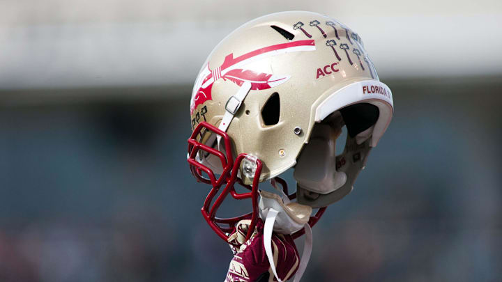 Nov 9, 2013; Winston-Salem, NC, USA; A Florida State Seminoles player holds up a helmet prior to kickoff against the Wake Forest Demon Deacons at BB&T Field. Mandatory Credit: Jeremy Brevard-Imagn Images