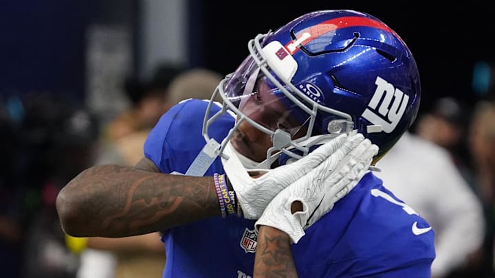 Sep 14, 2025; Arlington, Texas, USA; New York Giants wide receiver Malik Nabers (1) reacts after scoring a touchdown during the fourth quarter at AT&T Stadium. Mandatory Credit: Raymond Carlin III-Imagn Images