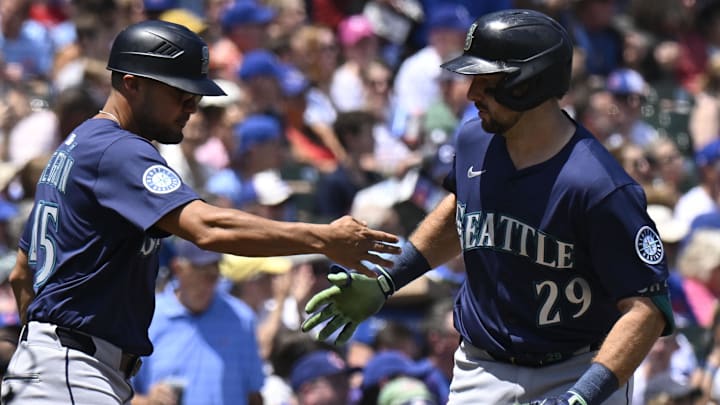 Seattle Mariners catcher Cal Raleigh (right) celebrates after hitting a home run against the Chicago Cubs on June 20 at Wrigley Field.