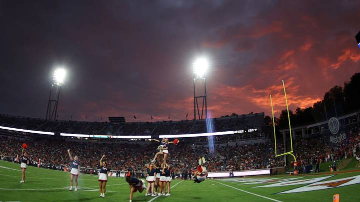 Sep 26, 2026; Charlottesville, Virginia, USA; Virginia Cavaliers cheerleaders cheer on the field during a timeout against the Delaware Blue Hens during the first half during a timeout at Scott Stadium. Mandatory Credit: Geoff Burke-Imagn Images