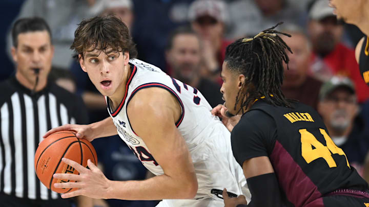 Gonzaga Bulldogs forward Braden Huff (34) fights for position against former Arizona State Sun Devils and current Gonzaga guard Adam Miller (44) in the first half of last season's meeting at McCarthey Athletic Center.