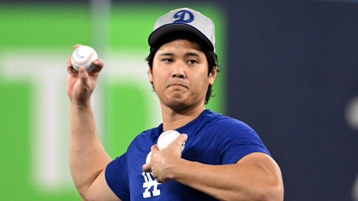 Oct 23, 2025; Toronto, ON, Canada;  Los Angeles Dodgers designated hitter Shohei Ohtani (17) performs pitching drills after batting practice during World Series team workouts at Rogers Centre. Mandatory Credit: Dan Hamilton-Imagn Images