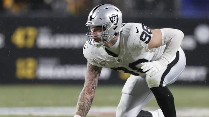 Dec 24, 2022; Pittsburgh, Pennsylvania, USA;  Las Vegas Raiders defensive end Maxx Crosby (98) at the line of scrimmage against the Pittsburgh Steelers during the third quarter at Acrisure Stadium. The Steelers won 13-10. Mandatory Credit: Charles LeClaire-Imagn Images