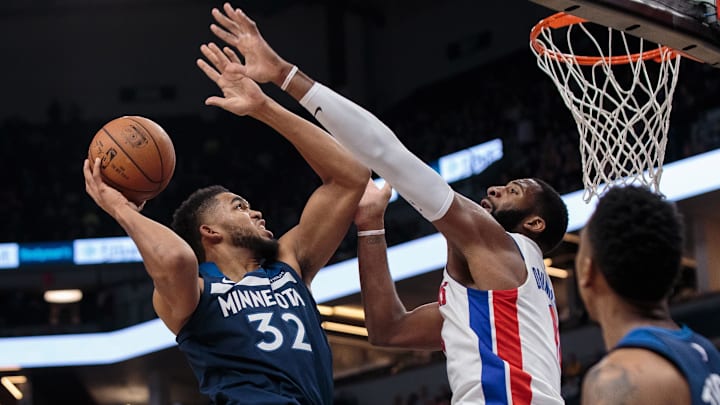 Nov 19, 2017; Minneapolis, MN, USA; Minnesota Timberwolves center Karl-Anthony Towns (32) shoots in the fourth quarter against the Detroit Pistons center Andre Drummond (0) at Target Center. Mandatory Credit: Brad Rempel-Imagn Images