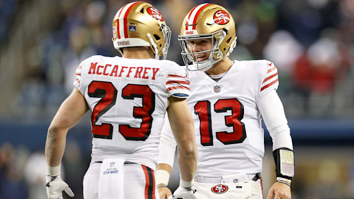 San Francisco 49ers running back Christian McCaffrey (23) with quarterback Brock Purdy (13) San Francisco 49ers running back Christian McCaffrey (23) with quarterback Brock Purdy (13)