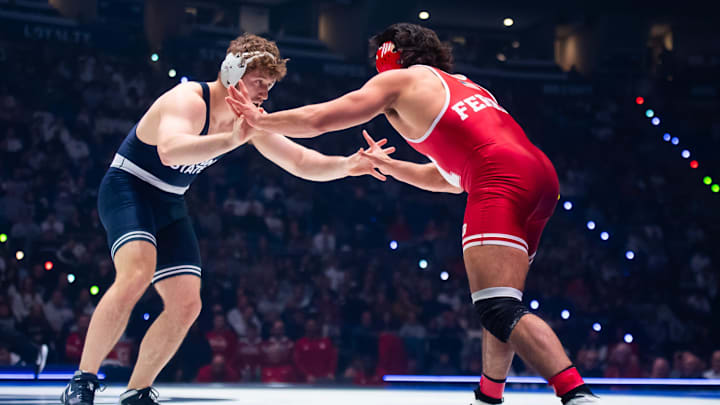 Penn Stat Nittany Lions wrestler Cole Mirasola wrestles the Nebraska Cornhuskers' AJ Ferrari in the heavyweight bout during a Big Ten match.