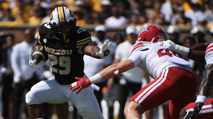 Sept 13, 2025; Columbia, Missouri, USA; Missouri Tigers running back Ahmad Hardy blocks during a rush against Louisiana in the first quarter at Faurot Field. 