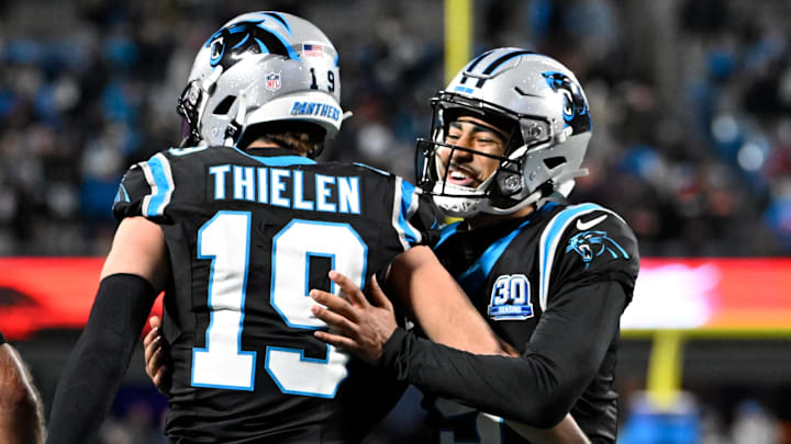 Dec 1, 2024; Charlotte, North Carolina, USA; Carolina Panthers wide receiver Adam Thielen (19) celebrates with quarterback Bryce Young (9) after scoring a touchdown with 30 seconds left in the fourth quarter at Bank of America Stadium. Mandatory Credit: Bob Donnan-Imagn Images