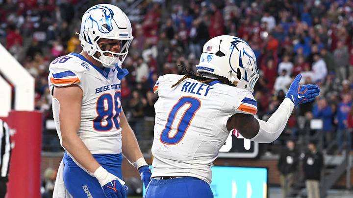 Boise State running back Dylan Riley (0) and tight end Matt Wagner celebrate a touchdown against Washington State. Boise State running back Dylan Riley (0) and tight end Matt Wagner celebrate a touchdown against Washington State.