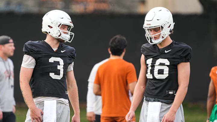 Quarterbacks Quinn Ewers (3) and Arch Manning (16) talk during the first Texas Longhorns football
