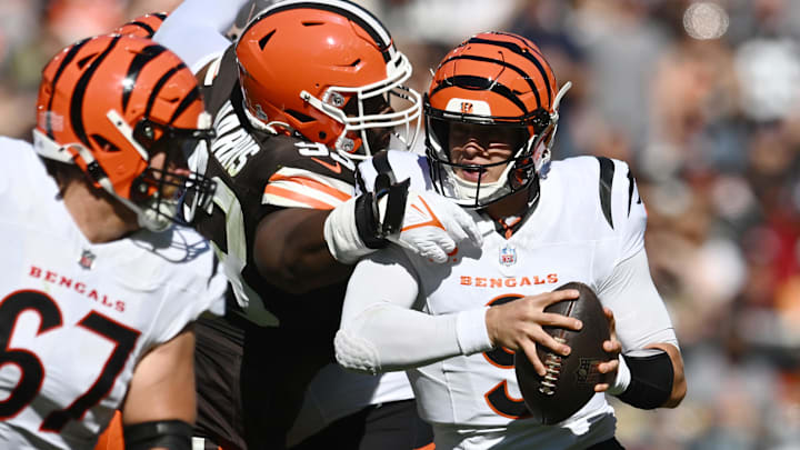 Oct 20, 2024; Cleveland, Ohio, USA; Cleveland Browns defensive tackle Shelby Harris (93) sacks Cincinnati Bengals quarterback Joe Burrow (9) during the first quarter at Huntington Bank Field. Mandatory Credit: Ken Blaze-Imagn Images