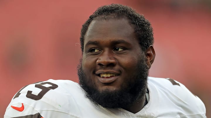 Cleveland Browns offensive tackle Dawand Jones (79) is all smiles after an NFL preseason football game at Cleveland Browns Stadium, Saturday, Aug. 10, 2024, in Cleveland, Ohio.
