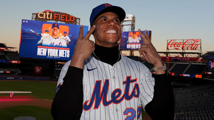 Dec 12, 2024; Flushing, NY, USA; New York Mets right fielder Juan Soto poses for photos during his introductory press conference at Citi Field. Mandatory Credit: Brad Penner-Imagn Images