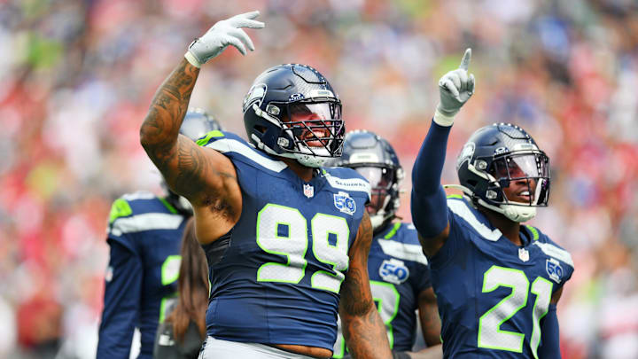 Sep 7, 2025; Seattle, Washington, USA; Seattle Seahawks defensive end Leonard Williams (99) reacts with the crown during the game against San Francisco 49ers at Lumen Field. 