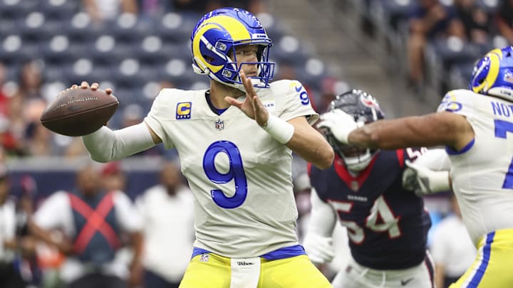 Oct 31, 2021; Houston, Texas, USA; Los Angeles Rams quarterback Matthew Stafford (9) attempts a pass during the first quarter against the Houston Texans at NRG Stadium. Mandatory Credit: Troy Taormina-Imagn Images