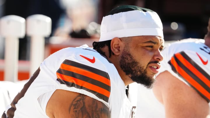 Nov 26, 2023; Denver, Colorado, USA;  Cleveland Browns center Nick Harris (53) sits on the sidelines before the game against the Denver Broncos at Empower Field at Mile High. Mandatory Credit: Ron Chenoy-USA TODAY Sports