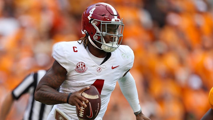 Oct 19, 2024; Knoxville, Tennessee, USA; Alabama Crimson Tide quarterback Jalen Milroe (4) scrambles against the Tennessee Volunteers during the second quarter at Neyland Stadium. Mandatory Credit: Randy Sartin-Imagn Images