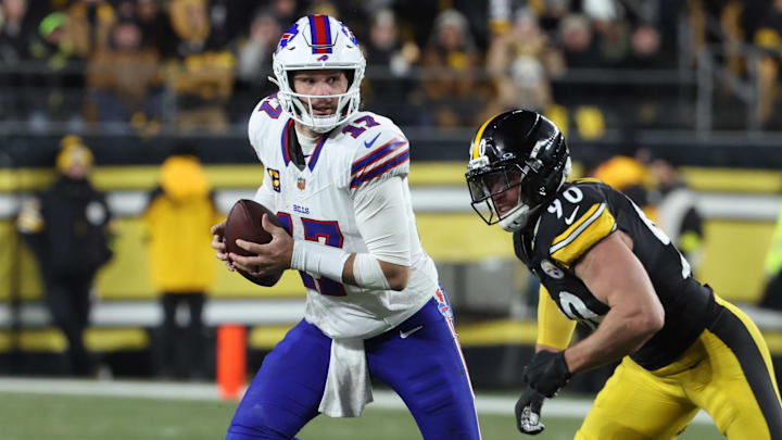 Nov 30, 2025; Pittsburgh, Pennsylvania, USA; Buffalo Bills quarterback Josh Allen (17) looks to pass as Pittsburgh Steelers linebacker T.J. Watt (90) defends during the second quarter at Acrisure Stadium.