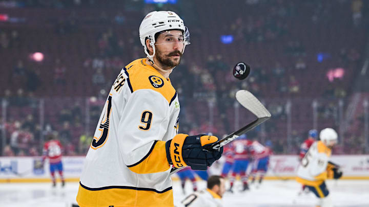 Dec 10, 2023; Montreal, Quebec, CAN; Nashville Predators left wing Filip Forsberg (9) plays with a