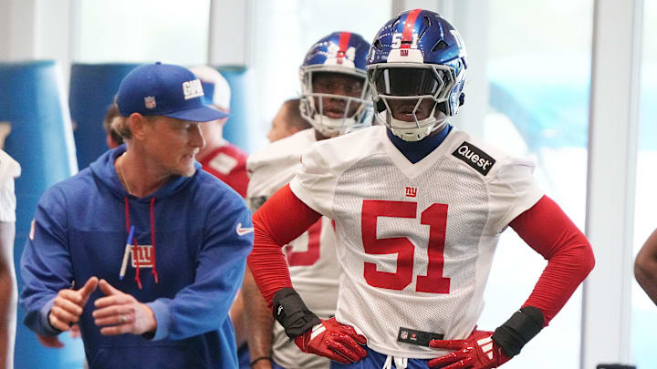 Charlie Bullen works with first round draft pick Abdul Carter. 