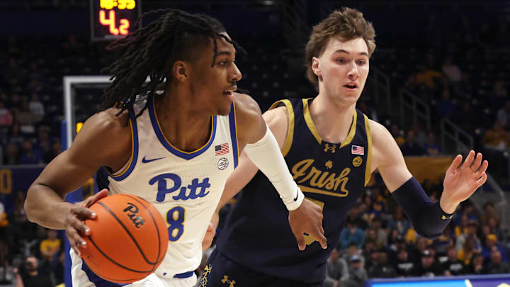 Feb 21, 2026; Pittsburgh, Pennsylvania, USA; Pittsburgh Panthers guard Omari Witherspoon (8) drives to the basket against Notre Dame Fighting Irish guard Cole Certa (right) during the first half at the Petersen Events Center. Mandatory Credit: Charles LeClaire-Imagn Images Feb 21, 2026; Pittsburgh, Pennsylvania, USA; Pittsburgh Panthers guard Omari Witherspoon (8) drives to the basket against Notre Dame Fighting Irish guard Cole Certa (right) during the first half at the Petersen Events Center. Mandatory Credit: Charles LeClaire-Imagn Images