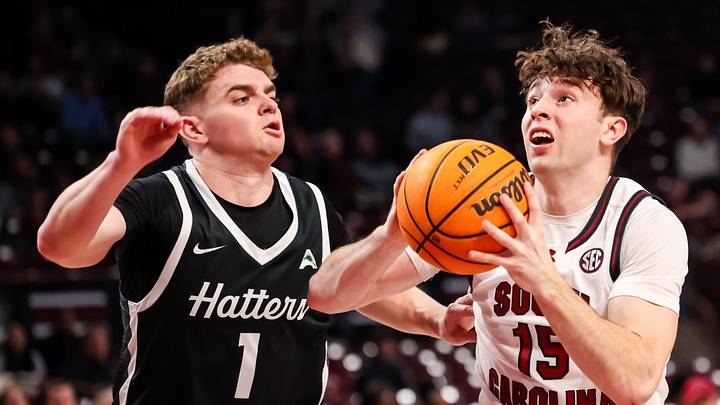 Dec 6, 2025; Columbia, S.C.; South Carolina guard Eli Ellis (15) drives around Stetson guard Ethan Copeland (1).