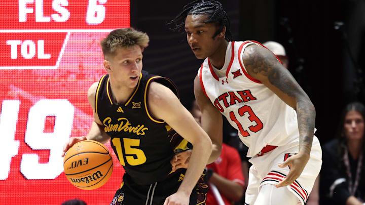 Feb 4, 2026; Salt Lake City, Utah, USA; Arizona State Sun Devils guard Noah Meeusen (15) posts up against Utah Utes forward Kendyl Sanders (13) during the second half at Jon M. Huntsman Center. Mandatory Credit: Rob Gray-Imagn Images