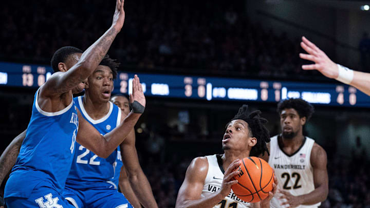 Vanderbilt Commodores guard AJ Hoggard (11) prepares to shoot against Kentucky Wildcats forward Brandon Garrison (10) and Amari Williams (22) during their game at Memorial Gym in Nashville, Tenn., Saturday, Jan. 25, 2025.