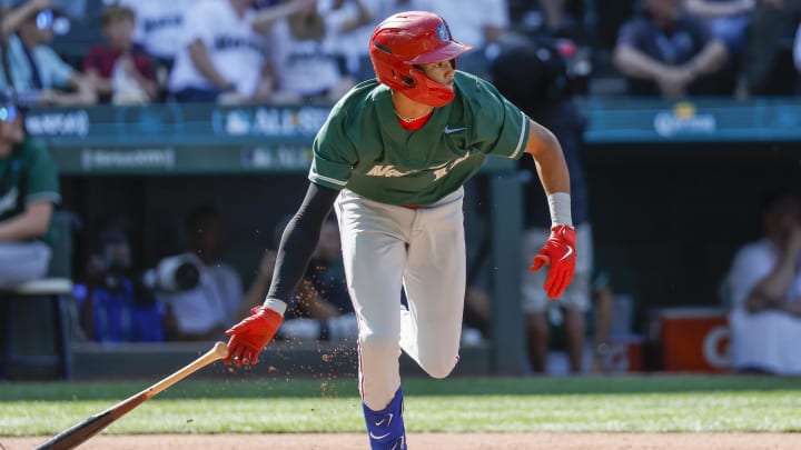 Jul 8, 2023; Seattle, Washington, USA; National League Futures designated hitter Justin Crawford (13) of the Philadelphia Phillies hits an RBI-sacrifice fly against the American League Futures during the second inning of the All Star-Futures Game at T-Mobile Park. Jul 8, 2023; Seattle, Washington, USA; National League Futures designated hitter Justin Crawford (13) of the Philadelphia Phillies hits an RBI-sacrifice fly against the American League Futures during the second inning of the All Star-Futures Game at T-Mobile Park.