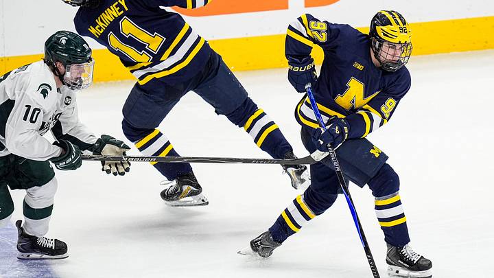 Michigan forward Adam Valentini (92) skates with the puck against Michigan State forward Tommi Männistö (10) during the third period of Duel in the D at Little Caesars Arena in Detroit on Saturday, February 7, 2026.