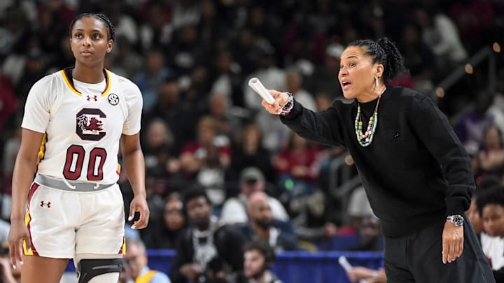 South Carolina Gamecocks guard Ta'niya Latson (00) talks to South Carolina Gamecocks head coach Dawn Staley Sunday, March 8, 2026, during the SEC Women's Basketball Tournament Championship game against the Texas Longhorns at Bon Secours Wellness Arena in Greenville, South Carolina.
