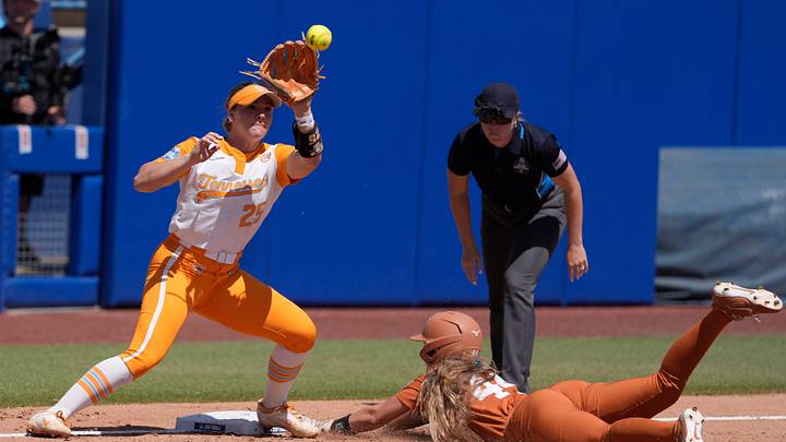 Texas Longhorns utility Kaiah Altmeyer (44) slides to third base as Tennessee Lady Volunteers infielder Ella Dodge (25) waits for the ball in the third inning of a Women's College World Series softball game between the University of Texas Longhorns and the Tennessee Lady Volunteers at Devon Park in Oklahoma City, Monday, June 1, 2026. Texas Longhorns utility Kaiah Altmeyer (44) slides to third base as Tennessee Lady Volunteers infielder Ella Dodge (25) waits for the ball in the third inning of a Women's College World Series softball game between the University of Texas Longhorns and the Tennessee Lady Volunteers at Devon Park in Oklahoma City, Monday, June 1, 2026.