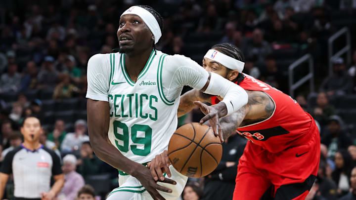 Oct 15, 2025; Boston, Massachusetts, USA; Toronto Raptors forward Brandon Ingram (3) knocks the ball away from Boston Celtics center Chris Boucher (99) during the first half at TD Garden. Mandatory Credit: Paul Rutherford-Imagn Images