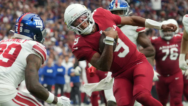 Arizona Cardinals quarterback Joshua Dobbs (9) breaks past New York Giants safety Xavier McKinney