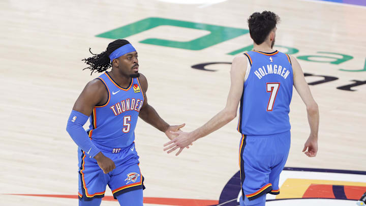 Apr 8, 2025; Oklahoma City, Oklahoma, USA; Oklahoma City Thunder guard Luguentz Dort (5) and Oklahoma City Thunder forward Chet Holmgren (7) celebrate after scoring against the Los Angeles Lakers during the first quarter at Paycom Center. Mandatory Credit: Alonzo Adams-Imagn Images Apr 8, 2025; Oklahoma City, Oklahoma, USA; Oklahoma City Thunder guard Luguentz Dort (5) and Oklahoma City Thunder forward Chet Holmgren (7) celebrate after scoring against the Los Angeles Lakers during the first quarter at Paycom Center. Mandatory Credit: Alonzo Adams-Imagn Images