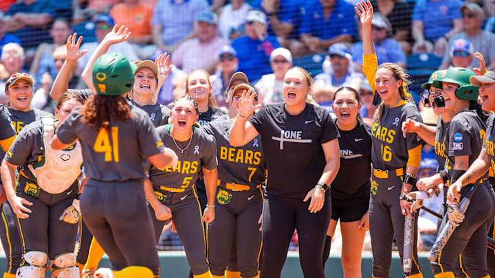 Baylor Bears infielder Aliyah Binford (41) is greeted by teammates at home plate after hitting a home run in the top of the third. The Florida Gator softball team played the Baylor Bears at Katie Seashole Pressly Stadium in Gainesville, FL on Friday, May 24, 2024. The Gators took the first game 4-2 in the NCAA Super Regionals. [Doug Engle/Gainesville Sun]