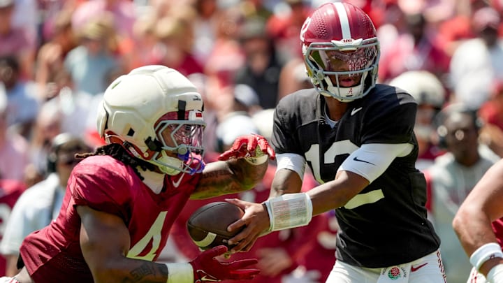 April 11, 2026; Tuscaloosa, AL, USA; Alabama quarterback Keelon Russell hands off to running back Daniel Hill at Bryant-Denny Stadium during the Alabama A Day scrimmage.