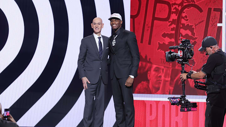 Jun 25, 2025; Brooklyn, NY, USA;  Cedric Coward stands with NBA commissioner Adam Silver after being selected as the 11th pick by the Portland Trail Blazers in the first round of the 2025 NBA Draft at Barclays Center. Mandatory Credit: Brad Penner-Imagn Images