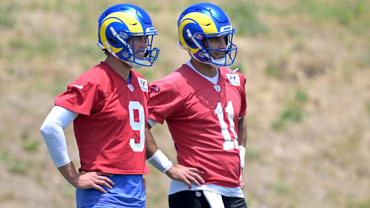 May 28, 2024; Thousand Oaks, CA, USA; Los Angeles Rams quarterbacks Matthew Stafford (9) and Jimmy Garoppolo (11) look on during OTAs at the team training facility at California Lutheran University. Mandatory Credit: Jayne Kamin-Oncea-Imagn Images May 28, 2024; Thousand Oaks, CA, USA; Los Angeles Rams quarterbacks Matthew Stafford (9) and Jimmy Garoppolo (11) look on during OTAs at the team training facility at California Lutheran University. Mandatory Credit: Jayne Kamin-Oncea-Imagn Images