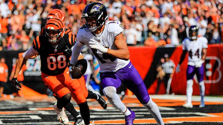 Oct 6, 2024; Cincinnati, Ohio, USA; Baltimore Ravens safety Kyle Hamilton (14) runs with the ball against Cincinnati Bengals tight end Mike Gesicki (88) in the first half at Paycor Stadium. Mandatory Credit: Katie Stratman-Imagn Images Oct 6, 2024; Cincinnati, Ohio, USA; Baltimore Ravens safety Kyle Hamilton (14) runs with the ball against Cincinnati Bengals tight end Mike Gesicki (88) in the first half at Paycor Stadium. Mandatory Credit: Katie Stratman-Imagn Images